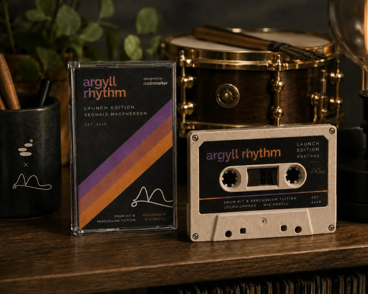 Argyll Rhythm launch-edition cassette and box beside a snare drum, with a Northmarker mug.