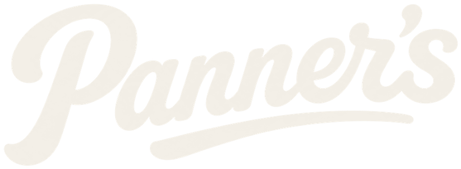 Panner's wordmark reversed in oat on peat dark.
